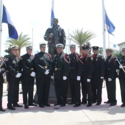 life size firefighter bronze statue with people in their military uniforms