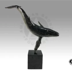 small bronze sculpture of a whale