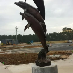 fine are public bronze animal sculpture of dolphins
