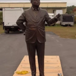 Monumental bronze statue of a man