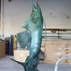 bronze animal sculpture of large marlin with green patina