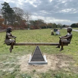 bronze memorial kids on seesaw playing