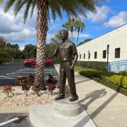 bronze life size statue of a man corpotation owner