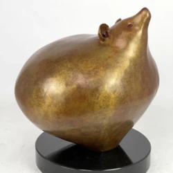 Fine Art Bronze Sculpture of a bear with a gold and red patina