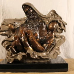 Bronze sculpture of Jesus holding Jerusalem