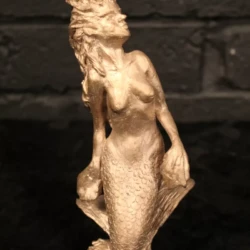 small bronze sculpture of a mermaid