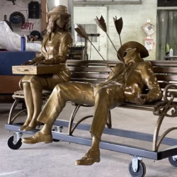 Corporates bronze people with a gold patina