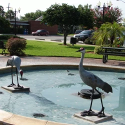 fine art bronze animal sculpture of cranes in the water