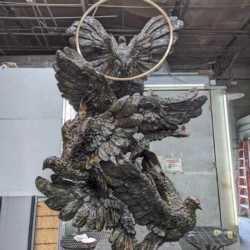bronze animal sculpture of large doves monumental