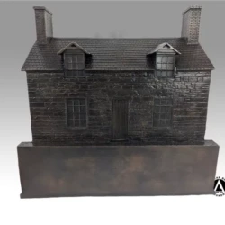bronze statue of a house