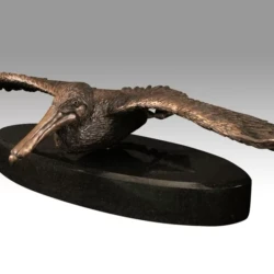 a bronze sculpture of a pelican by scott penegar